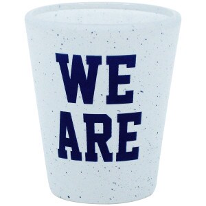 white shot glass with navy We Are and speckles
